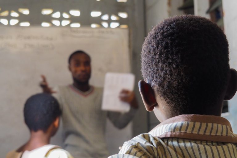 Teacher instructing students in a classroom